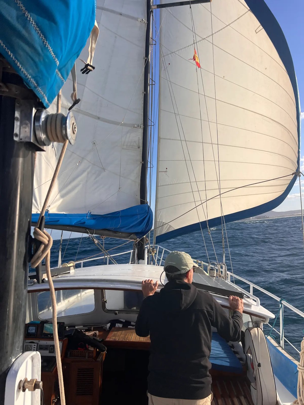 Skipper looking forward with both sails full of wind